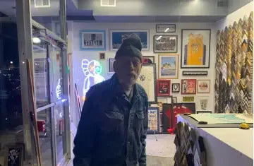 William 'Willy' Koetter standing in the frame shop doorway