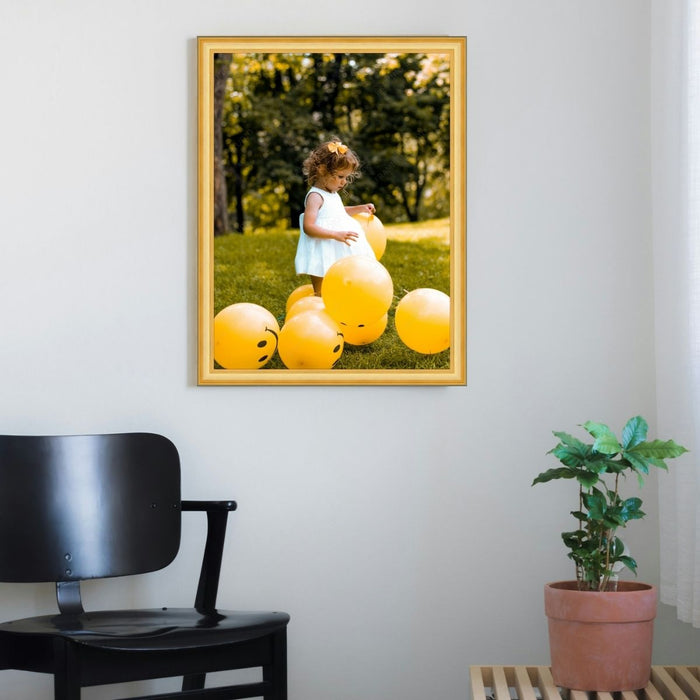 a picture of a little girl surrounded by yellow balloons