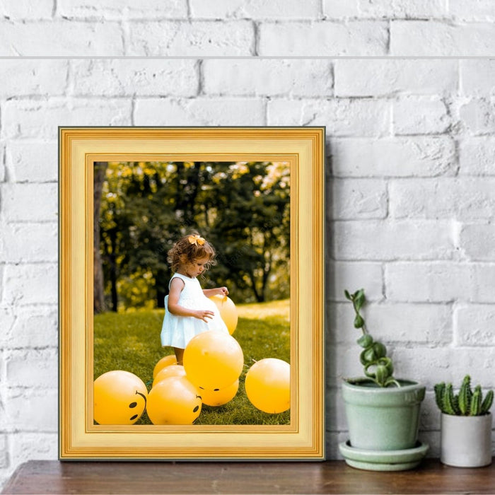 a picture of a little girl holding a bunch of balloons
