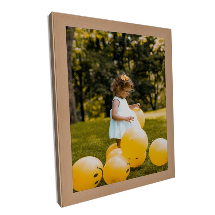 a picture of a little girl in a field with balloons
