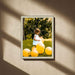 a little girl standing in a field of yellow balloons