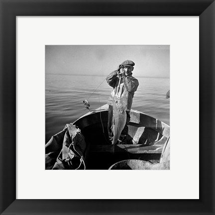 Framed Art Hauling in a cod aboard a Portuguese fishing dory off Cape Cod, Massachusetts Wall Decor 18x24 Artwork