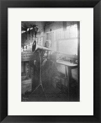 Thomas Alva Edison, full-length portrait, standing, facing right, listening to a new record