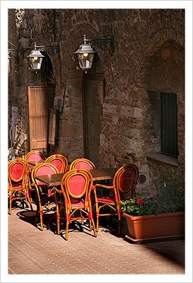 Framed Ristorante with Red Chairs, San Gimignano by Igor Maloratsky