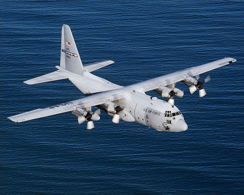 Framed C-130 Hercules Over Ocean, 1990’s by McMahan Photo Archive